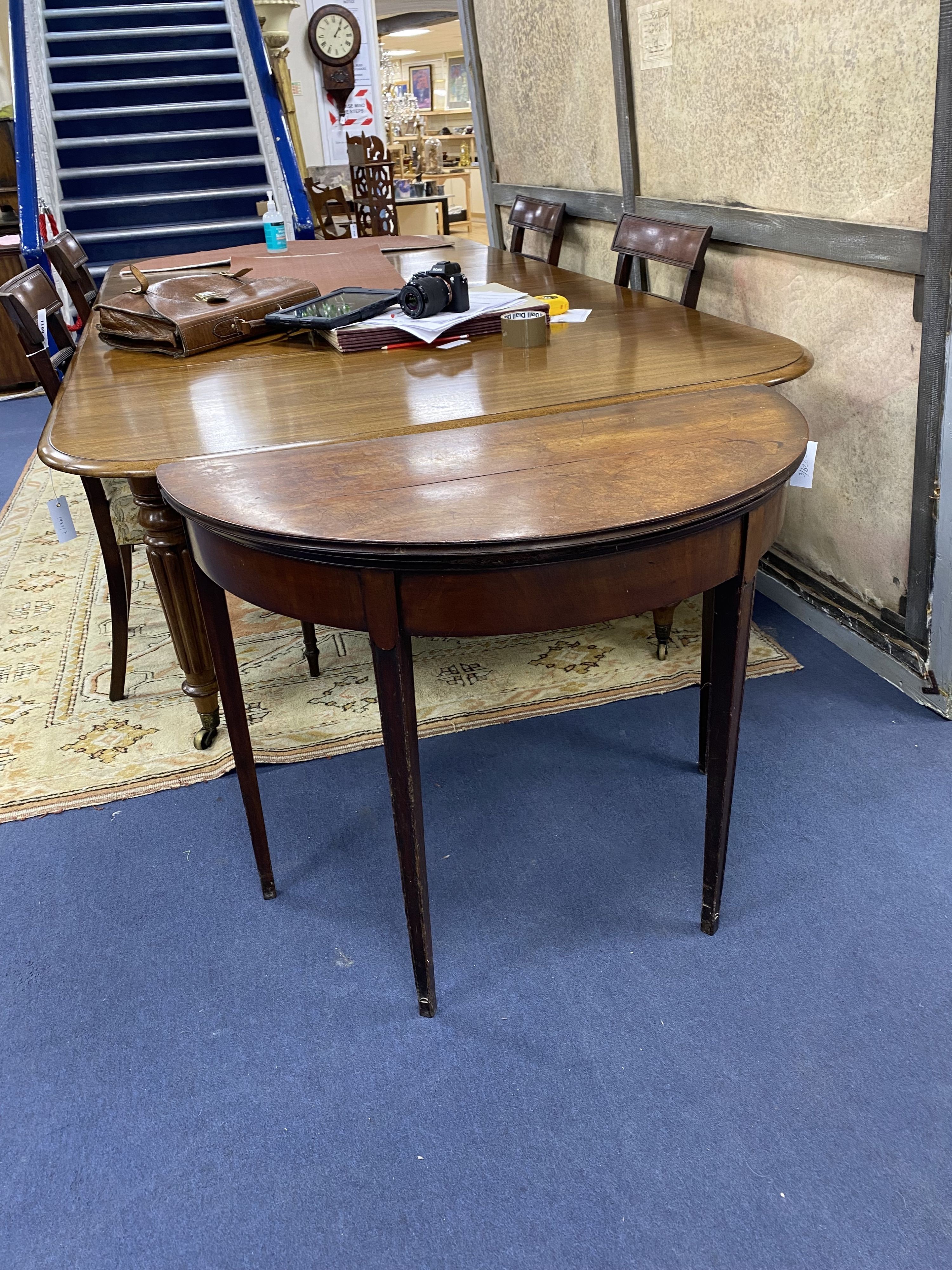A George III mahogany 'D' shaped folding card table (top split), width 90cm, depth 46cm, height 74cm
